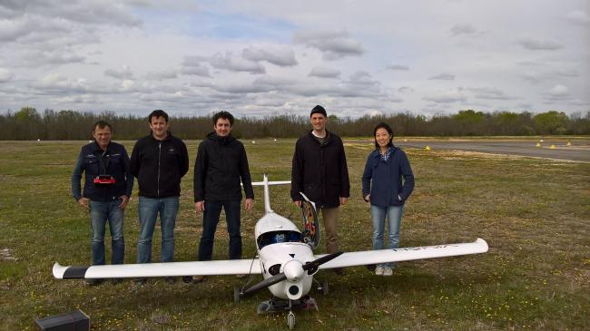 ONERA and SZTAKI members with the K50 aircraft. SZTAKI 2 camera system can be seen under the wings and the japanise RICOH stero sensor under the body.